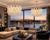 Pair chandelier featuring a circular metal frame with a gold finish, suspended from a matching chain. The light fixture is...