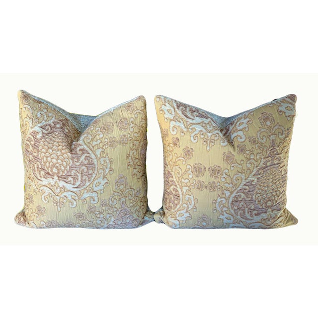 In an old world European style, these stunning pillows feature a golden toned brocade (warm khaki) with touches of light...