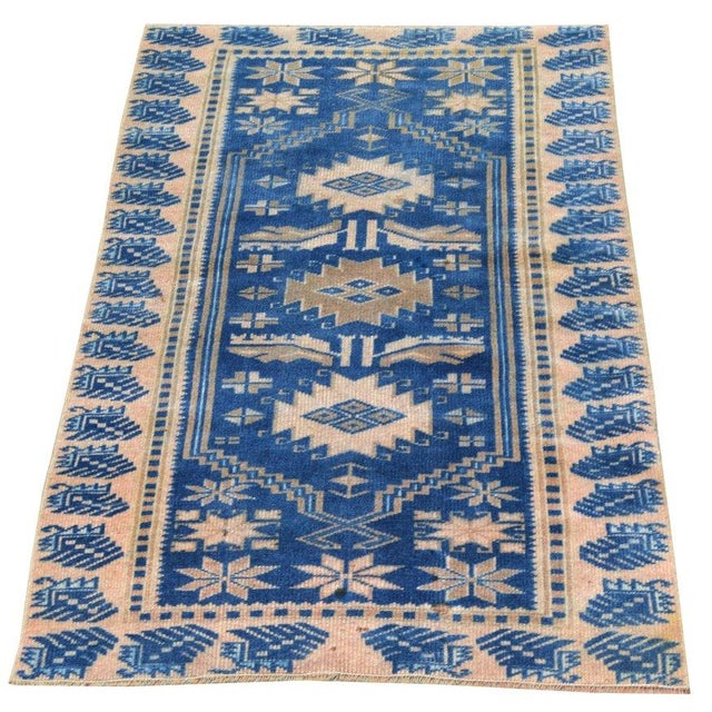 Hand-knotted with care using traditional rug-making techniques, this wool rug blends timeless craftsmanship with a modern...