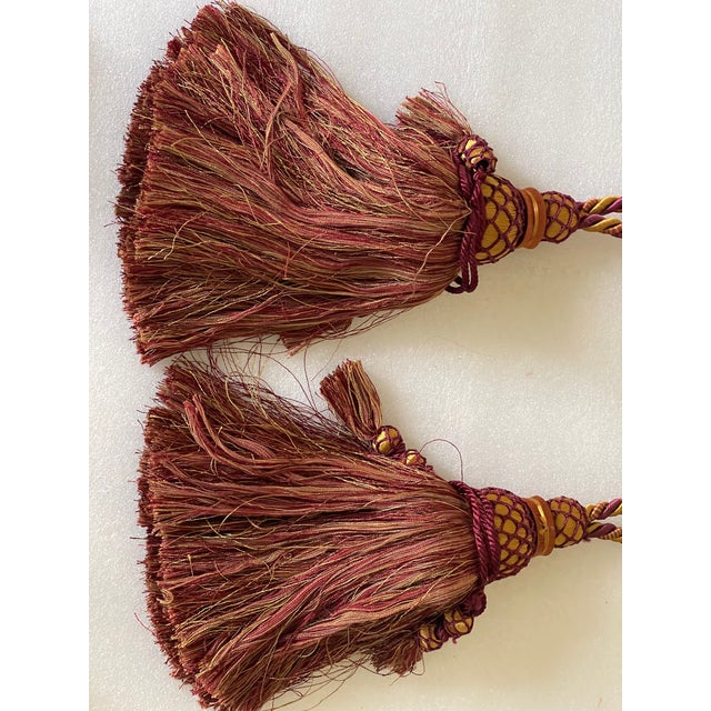 Pair of beautiful large burgundy red with gold silk Tiebacks with tassels. And matching tassels with screws.30”
