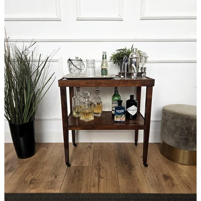Unique and very elegant Italian Art Deco Mid-Century dry bar cabinet cart with two burl wood tiers and highlighted by the...