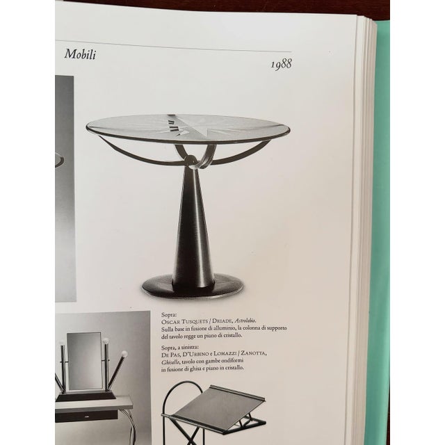 Astrolabio table designed by oscar tusquets in 1988. round frosted glass top with radial geometric engraving, paired with...