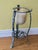 A large cast iron and glass antique indoor/outdoor candle holder/uplighter