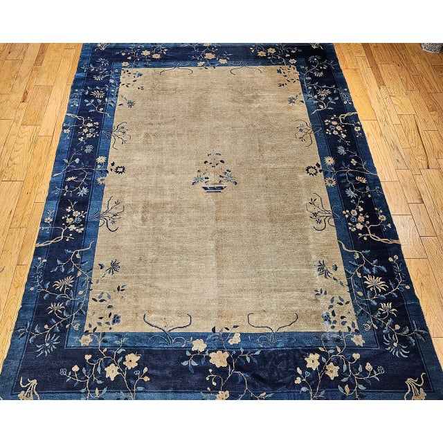 This vintage Chinese Peking room-size rug from the late 19th century embodies the meditative simplicity and quiet beauty...