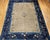 This vintage Chinese Peking room-size rug from the late 19th century embodies the meditative simplicity and quiet beauty...