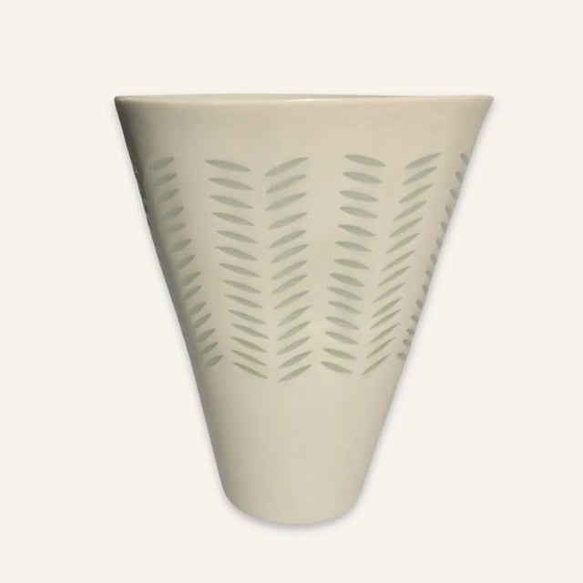 This white Finland Arabia rice grain porcelain vase is guaranteed to looking lovely with flowers, but it also stands alone...