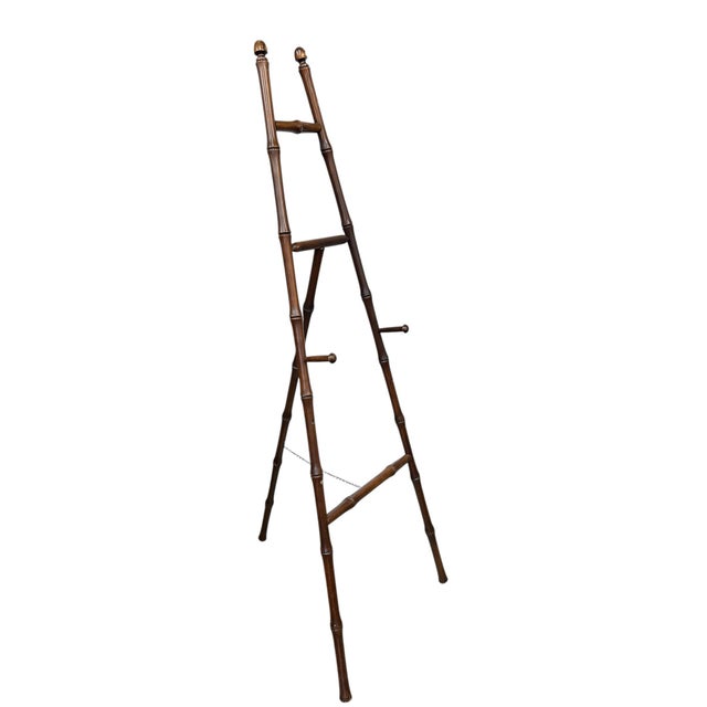 Vintage bamboo easel for larger art pieces. Hard to find in this dark brown finish. Three holes options for easel arms....