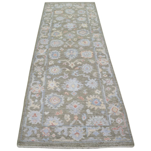 Hand-knotted with care using traditional rug making techniques, this wool rug blends timeless craftsmanship with a modern...