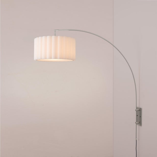 Wall-mounted overhead light with zero floor space used - satin nickel, cantilevered, smart-home ready. The Scallop Wall...