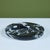 Round stone dish in a stunning Nero Marquina marble with white veining in the style of Angelo Mangiarotti. The dish...