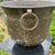 This vintage patinated hammered brass planter/jardiniere with ring handles features intricate repousse floral designs,...
