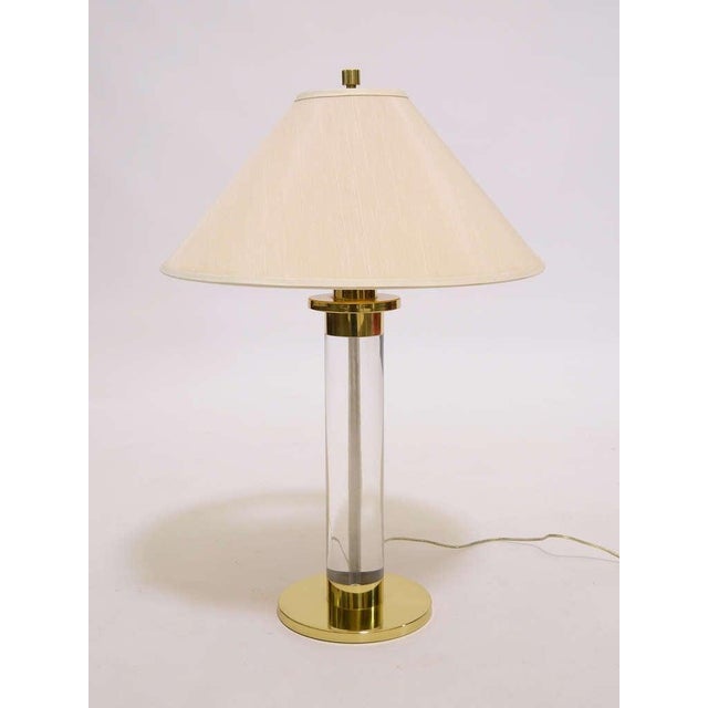Frederick Cooper was known for the high quality of their lamps and this handsome table lamp in lucite and brass is a prime...