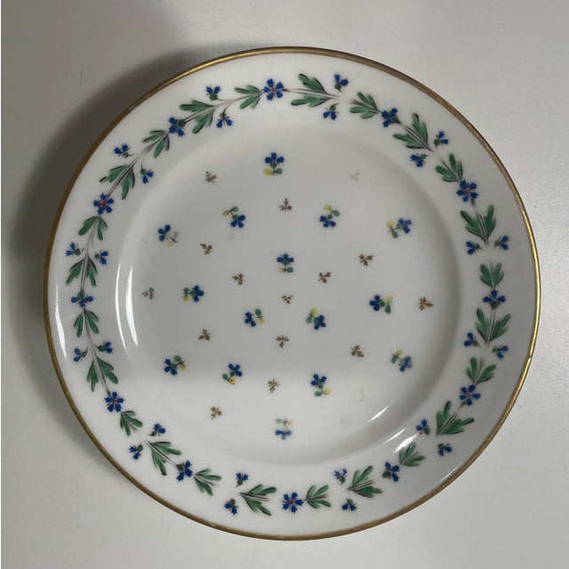 Antique 18th century French Louis XVI Paris porcelain. Rare to find....a Set of 8 plates decorated in the sprig cornflower...