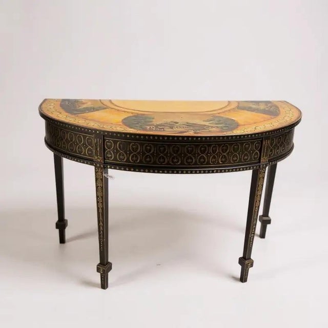 Elegant hand-painted wooden demi-lune console table featuring a richly decorated top with classical landscape scenes and...