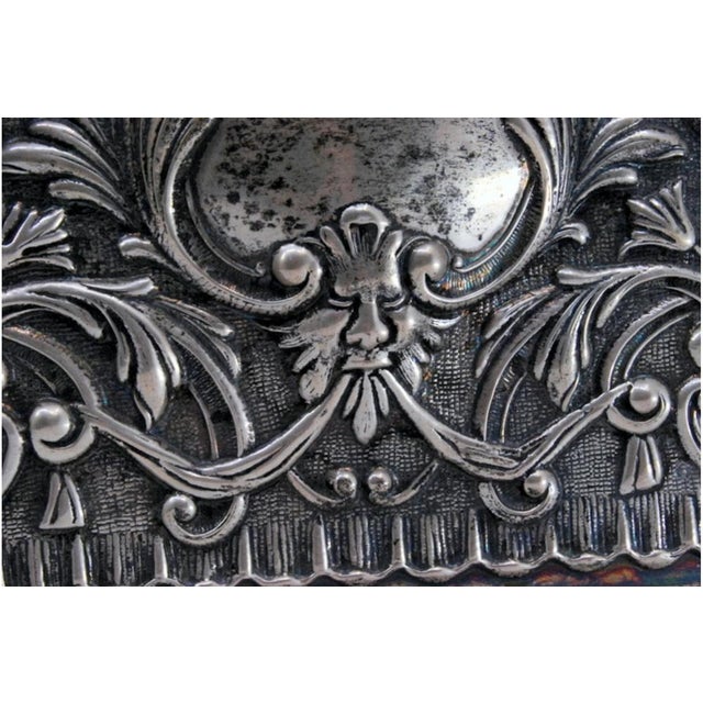 Flowers, Birds and Mask Embossed Silver Tray with Wavy Edge, in Very Good conditions. Designed from 2000 This piece has an...