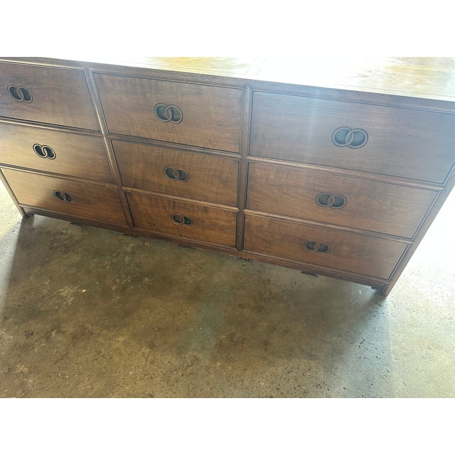 Beautiful nine-drawer dresser with carved countersunk interlaced dual ring drawer pulls, and molded and shaped apron on...