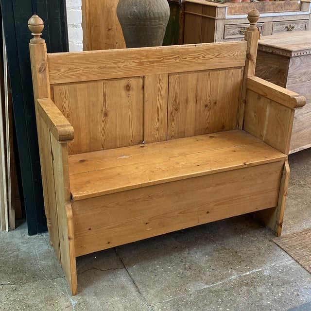 Late 19th Century pine storage bench handcrafted from a repurposed bed frame, featuring beautifully aged wood grain and...