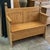 Late 19th Century pine storage bench handcrafted from a repurposed bed frame, featuring beautifully aged wood grain and...