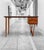 Danish writing desk in teak, c. 1960s, in the style of E.W. Bach. A particularly light and sculptural design combining a...