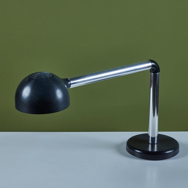 Tubular Desk Lamp by Robert Haussmann, c.1960s, Switzerland, has a sleek minimalist design. The lamp features a black...