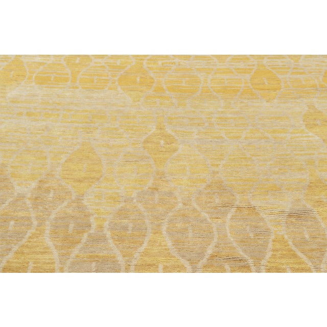 Hand-knotted in wool, this 6x10 rug is a luminous addition to Rug & Kilim’s Modern collection. This piece functions as a...