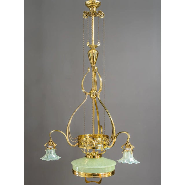 The chandelier is adjustable from 140cm - 163cm Brass polished and stove enameled Original antique opaline glass sades Up...