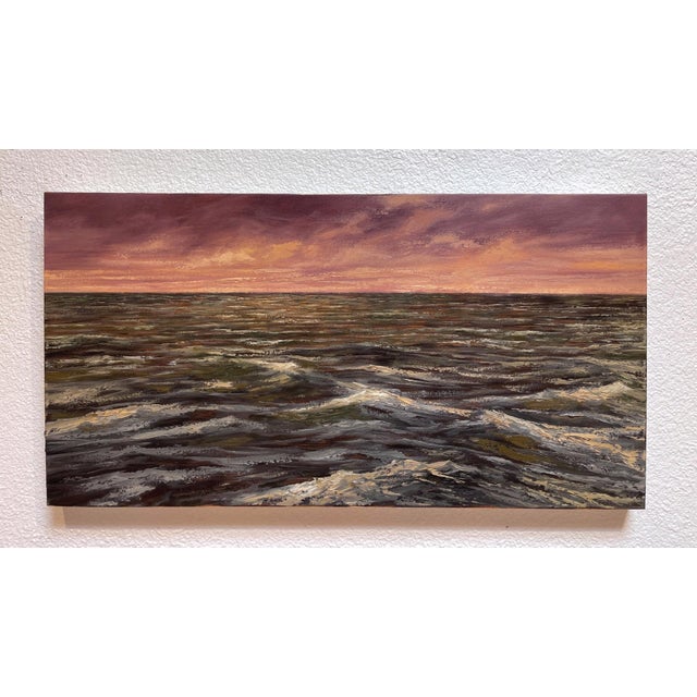 The painting depicts a tumultuous sea under a dramatic sky, where waves undulate with a sense of movement and energy....