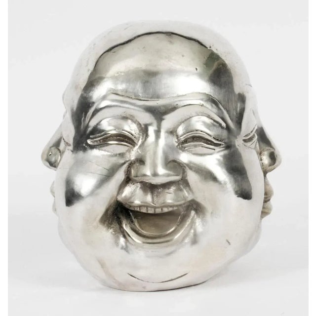 This is an interesting and very unusual silver plated bronze bust of the famous four-faced Buddha. This history of this...