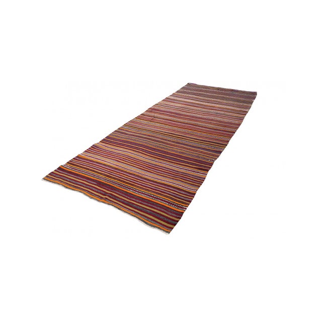 Handwoven vintage striped decorative kilim rug from Denizli region of Turkey. Approximately 50-60 years old. In very good...