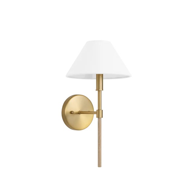 The Alfie Wall Sconce comes is a one light wall sconce with a white linen collie shade. Available in brushed brass, glossy...