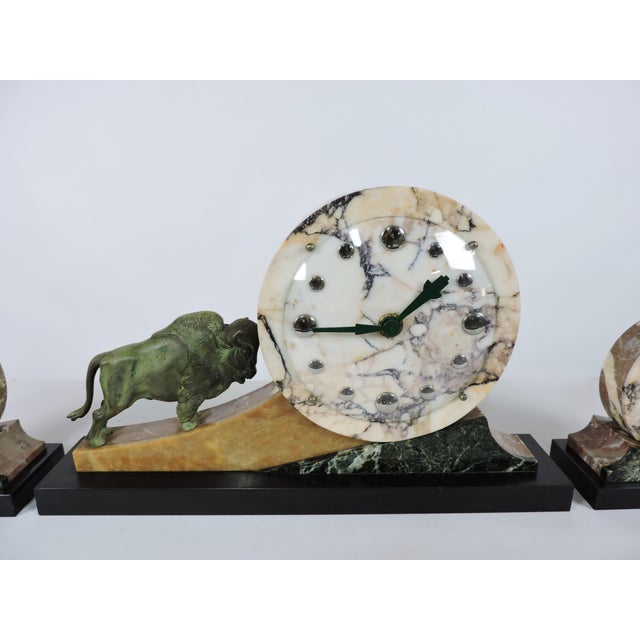 Beautiful Art Deco 3 piece mantel clock, most likely French. This high quality clock has a carved marble geometric design...