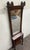 This is a stunning antique Victorian Eastlake hall or entry pier mirror featuring a large original mirror, carved floral...