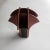 Handmade brown and black wooden vase made with black bent wood forming the small upper pockets that surround a deeper...