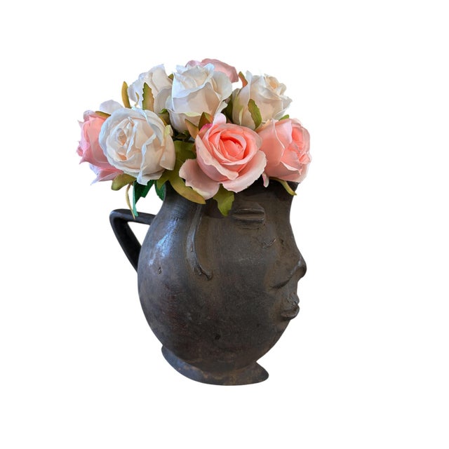 A well carved Kuba wooden cup in the form of a human head. Figural cups such as this cups are among the most popular...