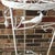 This is a beautiful mid century wrought and/or cast iron plant stand featuring birds (cardinals?), pine cones and pine...