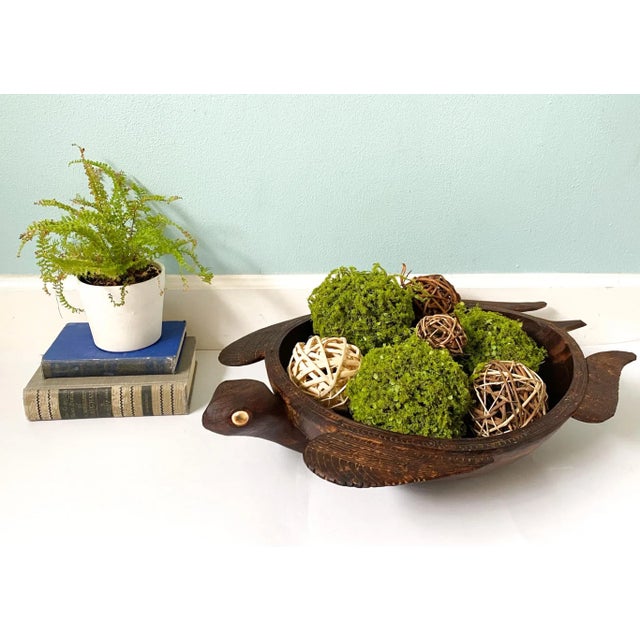 Charming island sea turtle with intricately carved border and flippers. Lovely dark wood finish and beautifully curved...