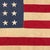 This vintage American flag is made from a very thin cotton cloth with fully sewn stars and stripes. Please note staining...
