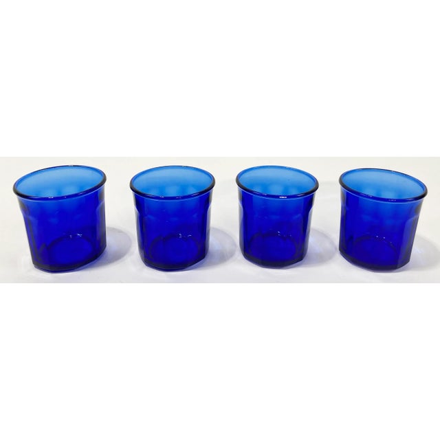 Set of four (4) vintage French jam or preserve jars in a vibrant cobalt blue. Wonderful as drinking glasses or candle...