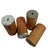 Early 1900s set of four wooden textile cylinder bobbins, each showing layered chipping paint and wear from decades of...