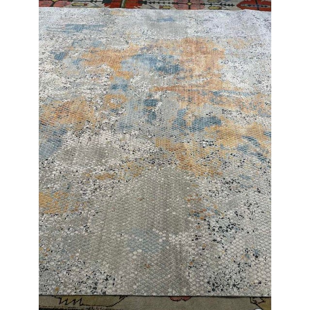 This exceptional modern rug, hand-knotted in Nepal, is a refined expression of contemporary design paired with time-...