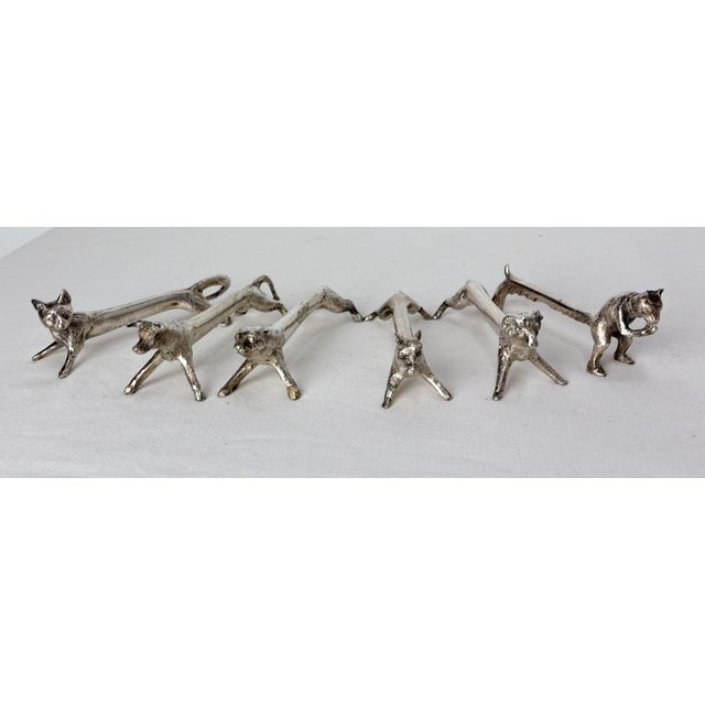 Set of six chrome knife holders shaped like animals: cat, bull, ram, squirrel, bear, wild boar. Ideal for a refined and...
