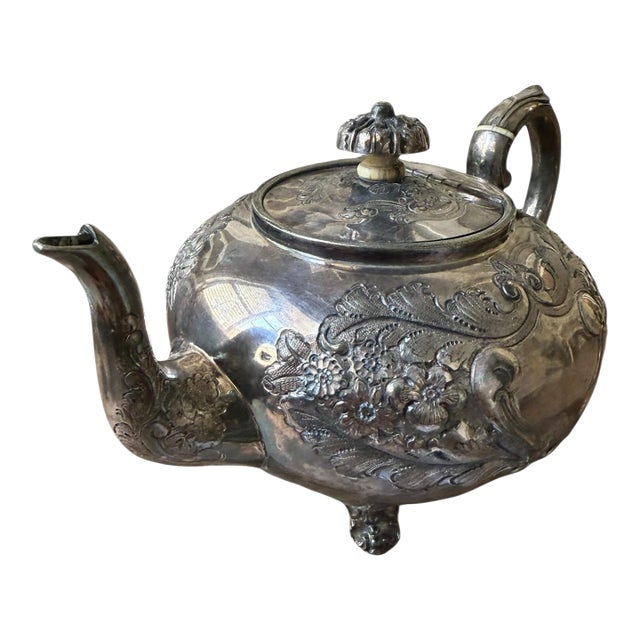 Early 20th Century Silver Pleated Teapot With Ornate Floral Repousse Decoration. For Sale