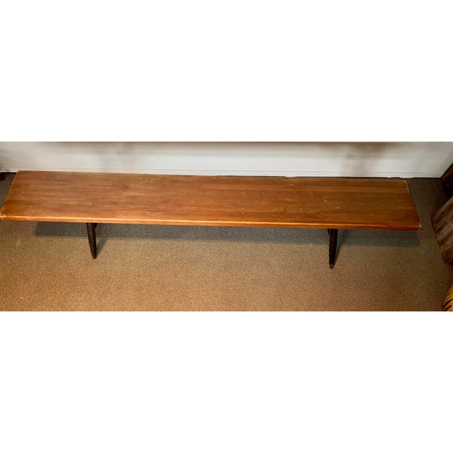 Bench by Ilmari Tapiovaara for Laukaan Puu, in Good conditions. Designed 1950 to 1959 This piece has an attribution mark,...