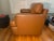 Late 20th Century Leather Chair upholstered in camel colored leather. With fitted loose seat and back cushion.