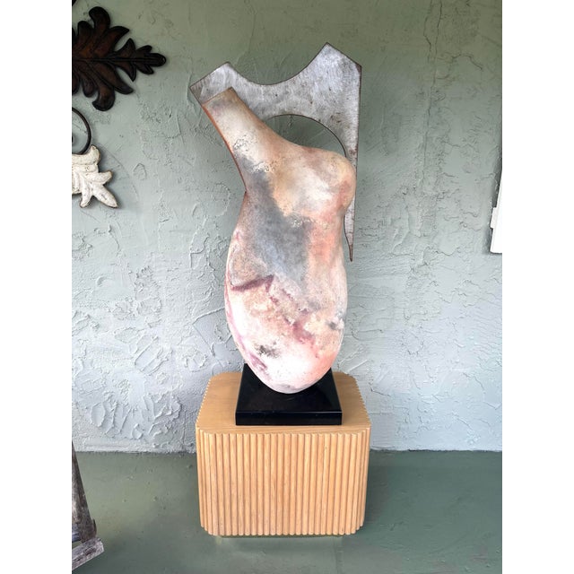 Steel Torso is a commanding large-scale abstract figurative sculpture by American artist Tom Neugebauer, signed and dated...