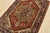 A traditional tribal Heriz rug hand-knotted with an all-wool pile on a cotton foundation. This oriental rug features a...