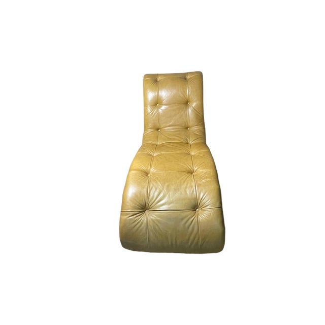 Beautifully upholstered biscuit tufted chaise lounge in golden Moore and Giles wax pull-up leather. Walnut finish on wood...