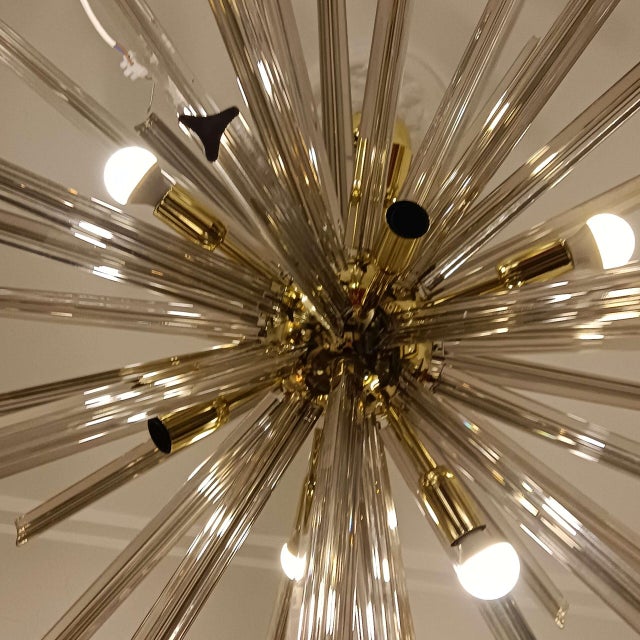 A splendid ceiling lamp crafted from Murano glass in a smoky gray hue. Its design is inspired by the iconic Sputnik lamp...