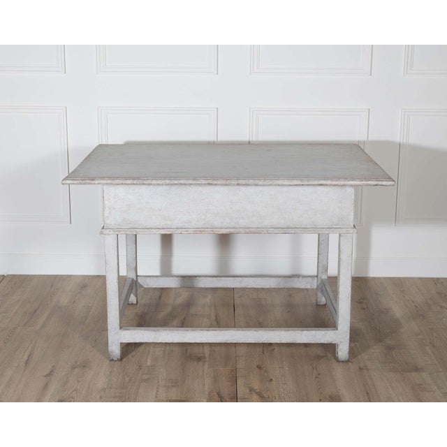 A rustic yet refined Swedish country table from the second half of the 19th century, crafted in solid pine. The...