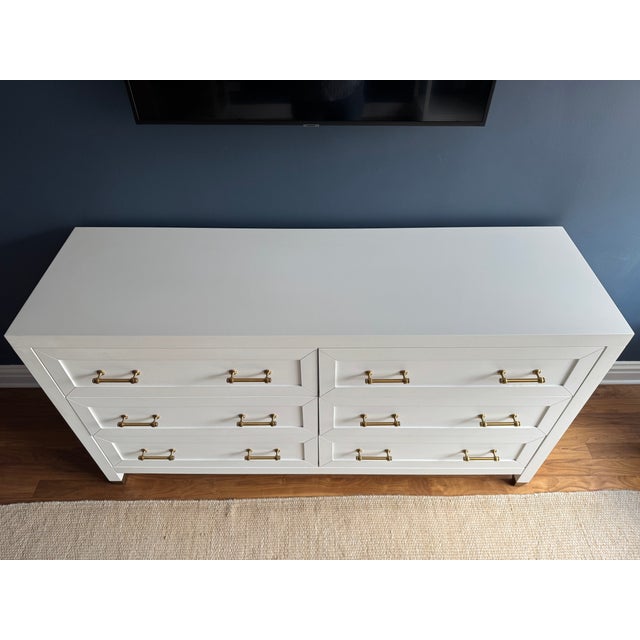 Matte white six-drawer double dresser from Orient Express. Gold hardware. Generous-sized drawers offer ample storage.